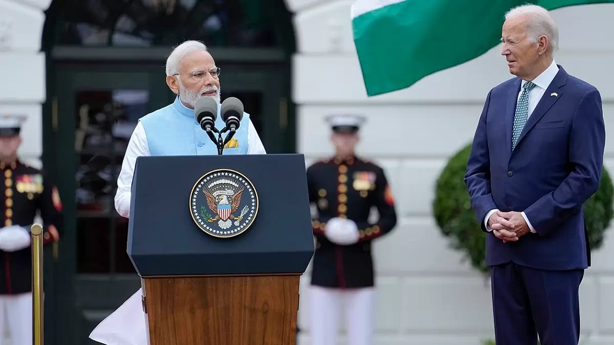 President Joe Biden listens as Indias Prime Minister Narendra Modi speaks at White House.