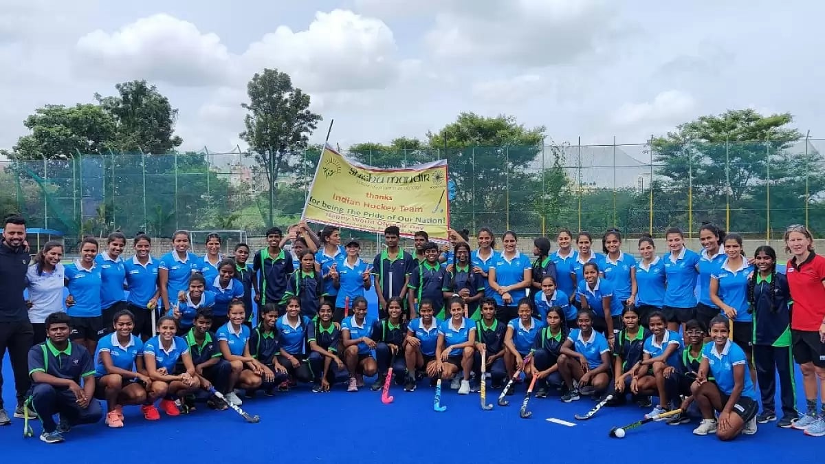 Players and staff of India Women's Hockey Team pictured with NGO kids.