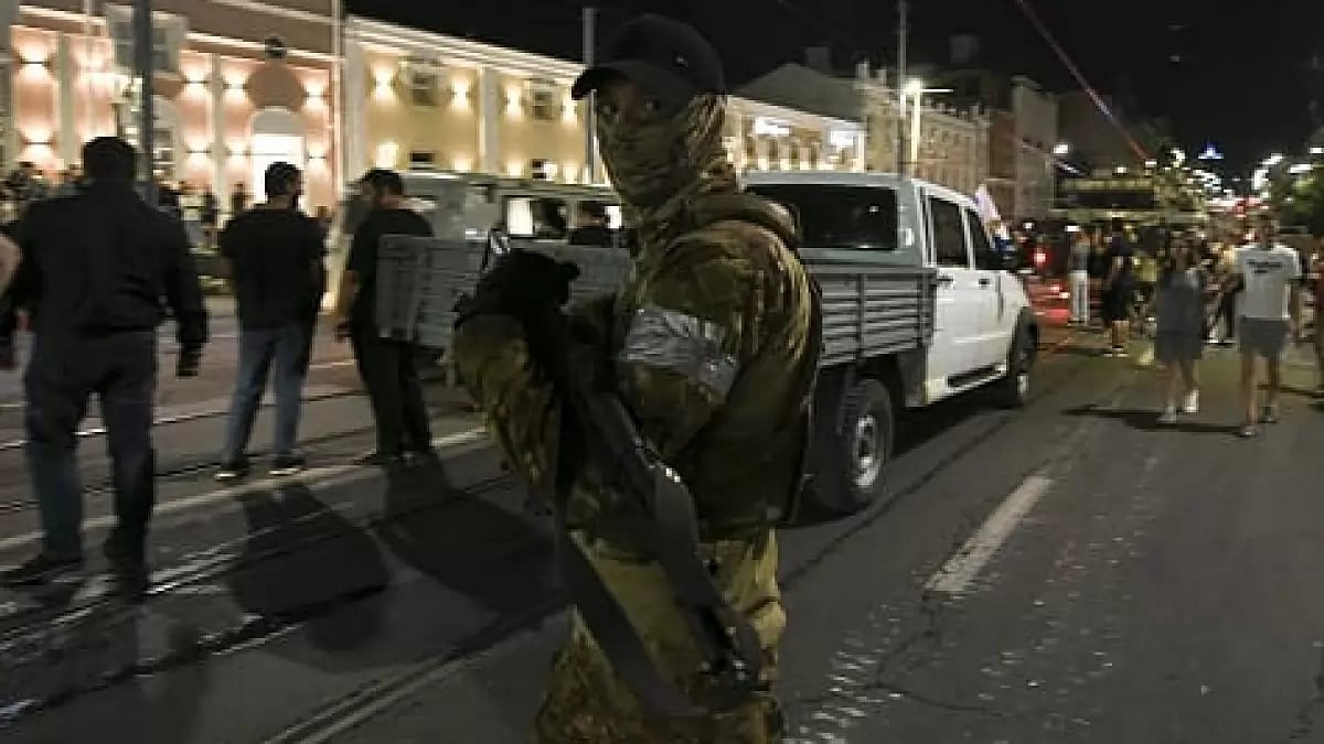 Members of the Wagner Group prepare to depart from the Southern Military District's headquarters and