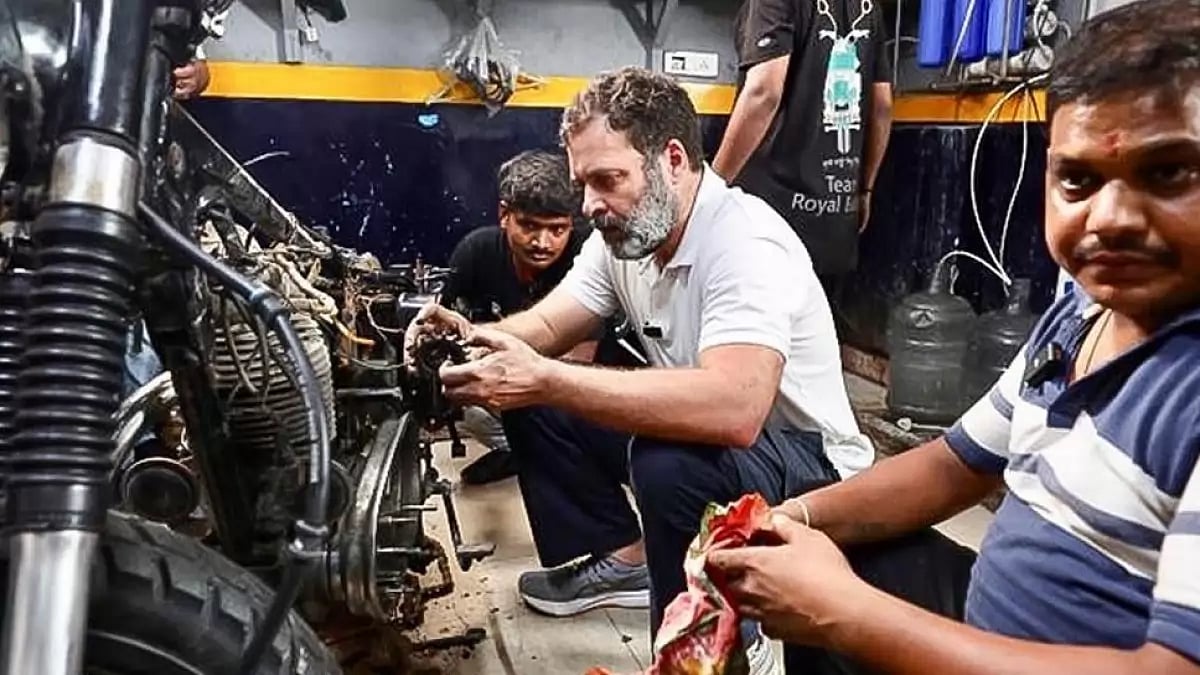 Rahul Gandhi at a motorcycle mechanic's shop in Karol Bagh