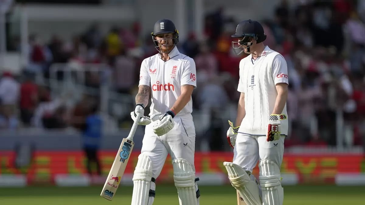 Stokes, left, and Brook leave the field after the end of 2nd Day's play.