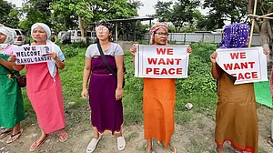 Women display placards at a relief camp in Moirang, Manipur.