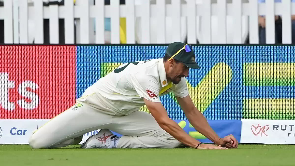 Starc pictured after taking Ben Duckett's catch at deep fine leg on Saturday.