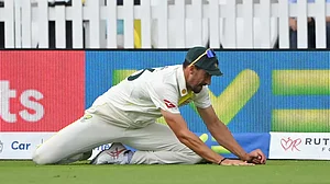 Starc pictured after taking Ben Duckett's catch at deep fine leg on Saturday.