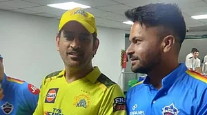 Mukesh Kumar, right, pictured with MS Dhoni during an IPL match.