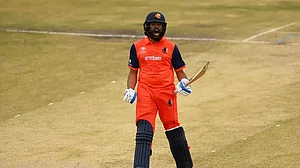 Vikramjit celebrates after reaching his hundred against Oman on Monday.