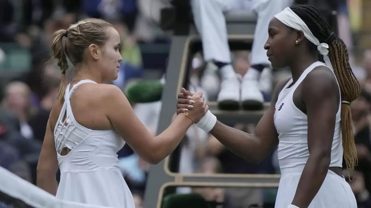 Sofia Kenin (left) shakes hands with Coco Gauff after their first round match.