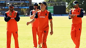 Bas de Leede (c) is clapped off by his teammates after picking five wickets.
