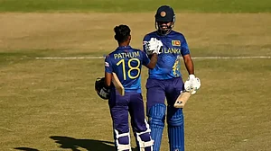 Nissanka is congratulated by Karunaratne after reaching his hundred against WI on Friday.