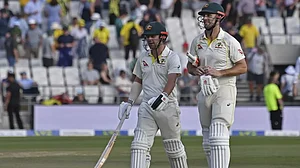 Head, left, and Marsh leave the field after the end of Day 2's play on Friday.