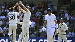 Pat Cummins celebrates the wicket of Joe Root at Headingley on Sunday.
