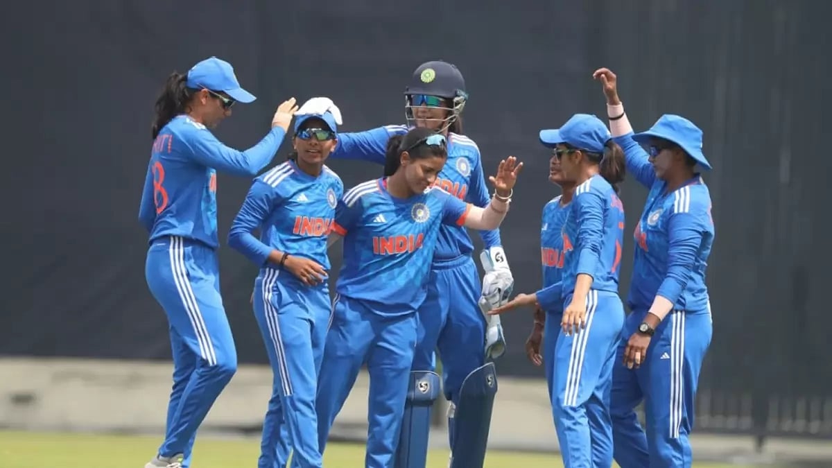 Minnu Mani, second left, is congratulated by her team-mates after dismissing Sultana on Sunday.