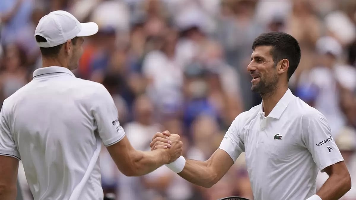 Djokovic, right, is congratulated by Hurkacz after his win on Monday.