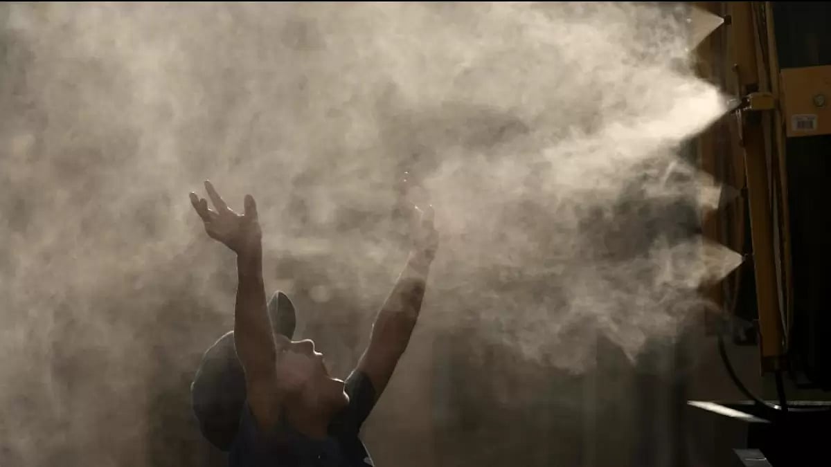 A young boy cools off as temperature approach degrees 100 degrees Fahrenheit in Kansas  - null
