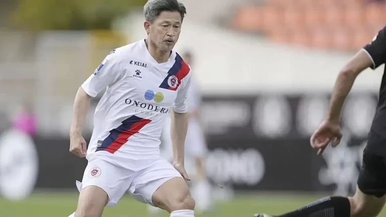 Former Japan forward Kazuyoshi Miura, left, plays for Oliveirense in the second half. - File