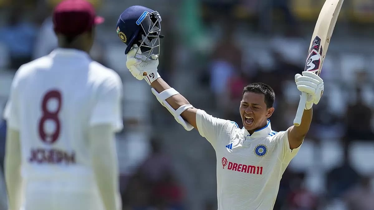 India's Yashasvi Jaiswal celebrates after scoring a century against West Indies.