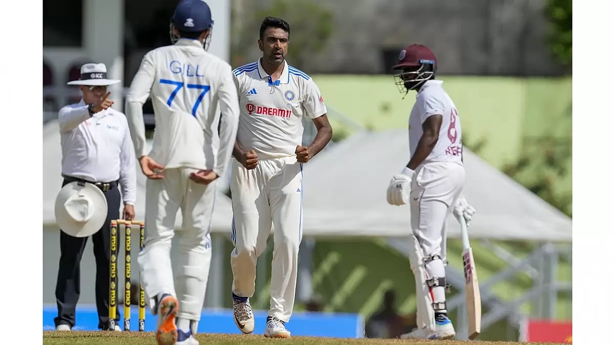 India's Ravichandran Ashwin celebrates taking a wicket of West Indies.