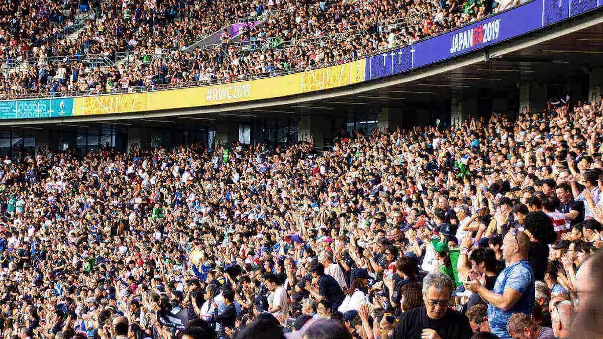  A stadium packed with a crowd of fans cheering on their teams.