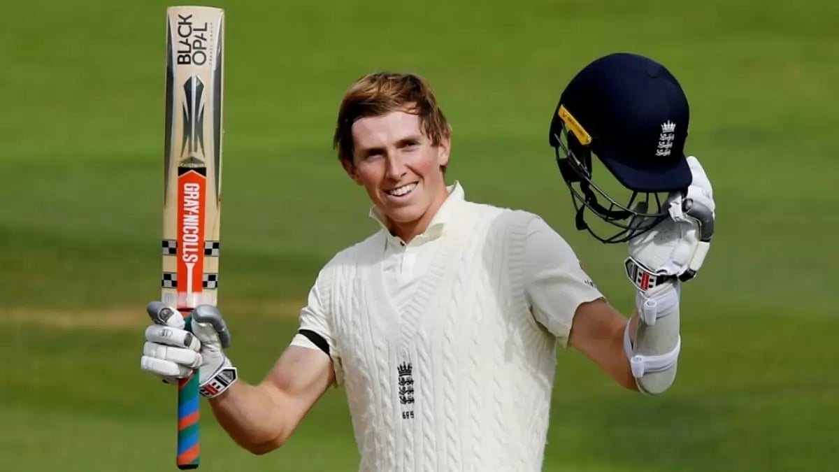 England's Zak Crawley raises his bat.