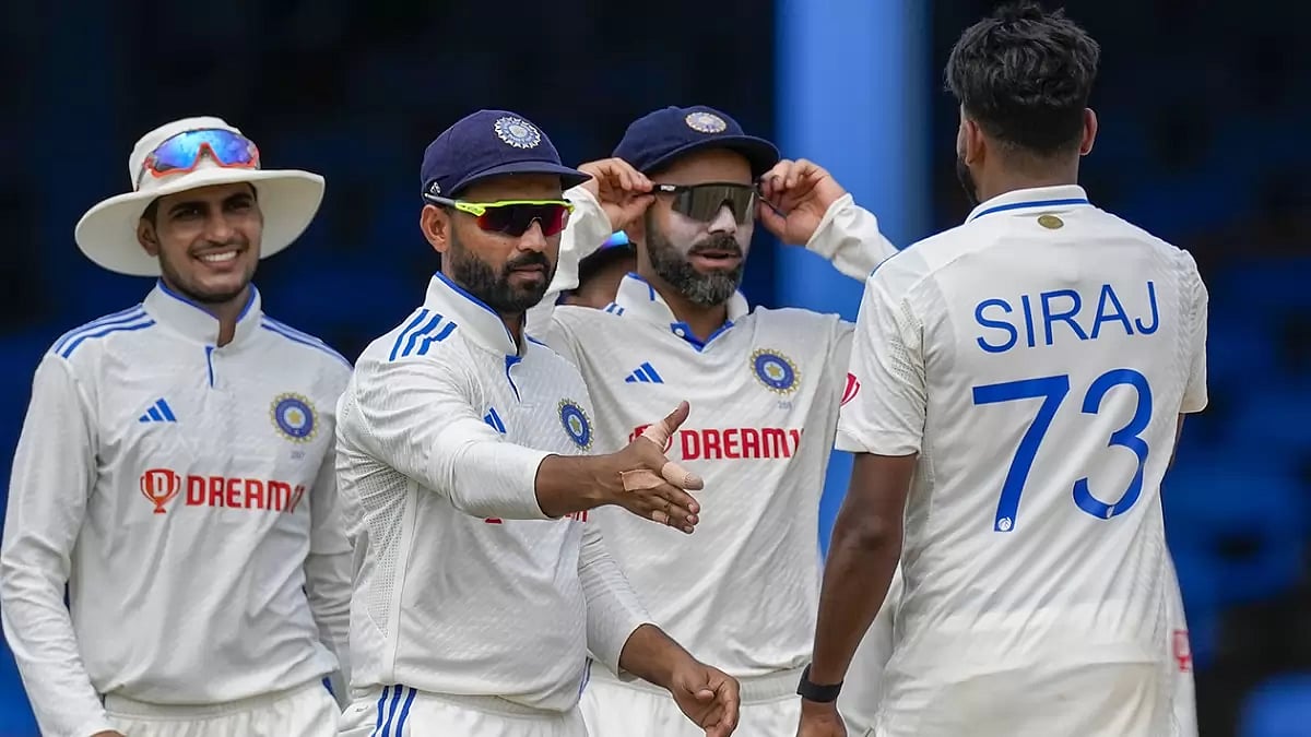India's Mohammed Siraj celebrates taking the wicket.