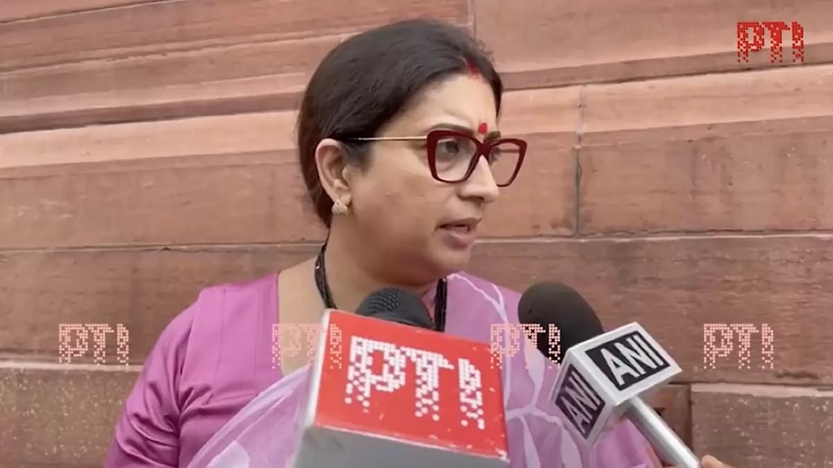 Smriti Irani speaks to reporters outside parliament