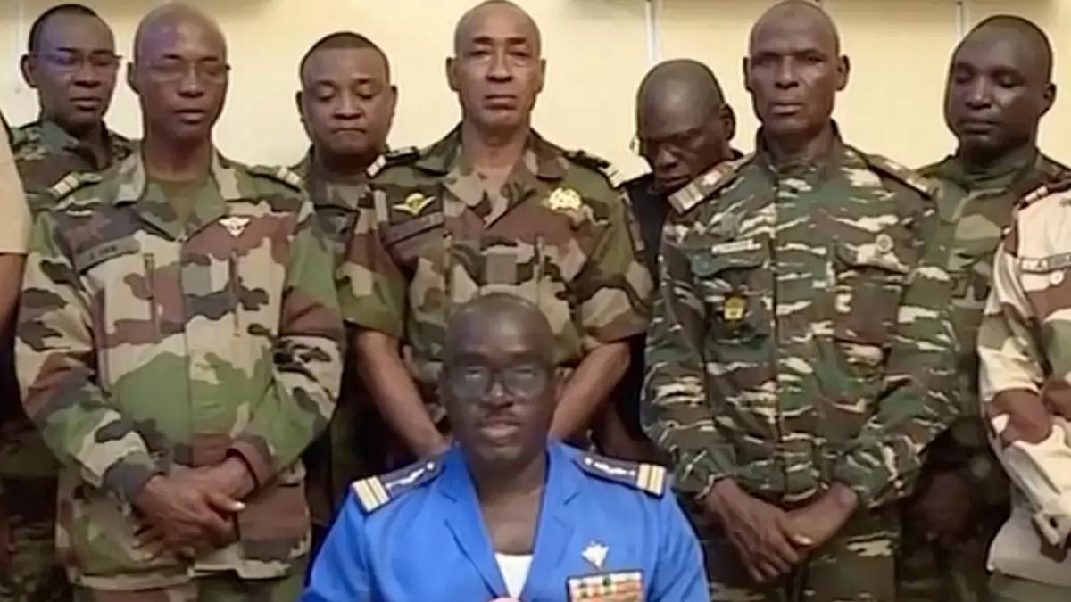 Members of Niger military group announcing their coup on national TV