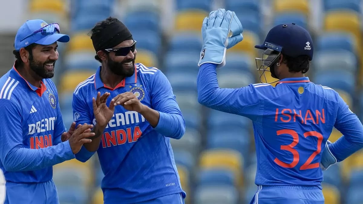 Ravindra Jadeja celebrates with Rohit Sharma after claiming a WI wicket.