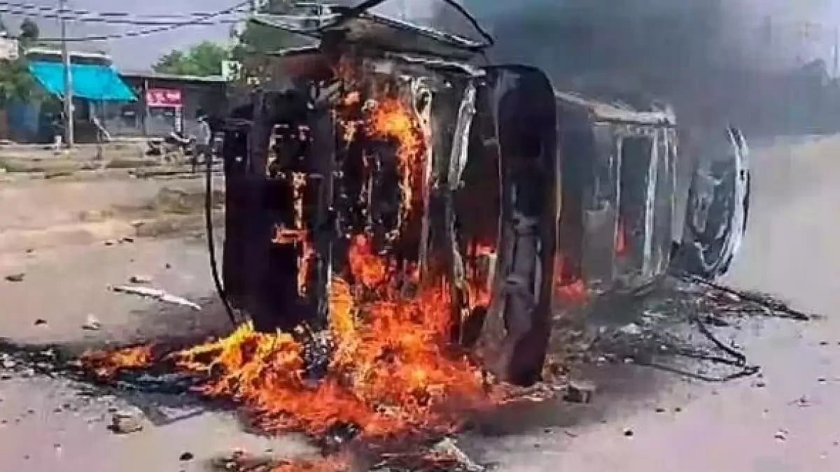 A vehicle set on fire after clashes erupted in Haryana's Nuh