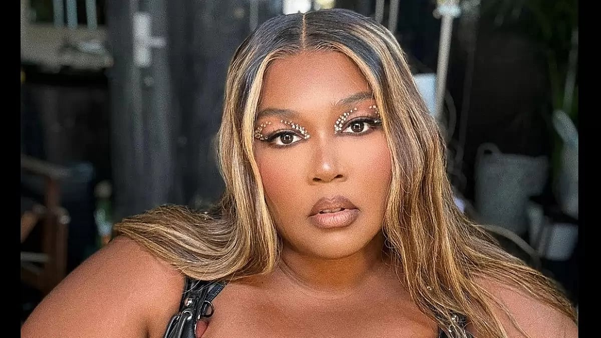 Pop Star Lizzo in black and silver dress