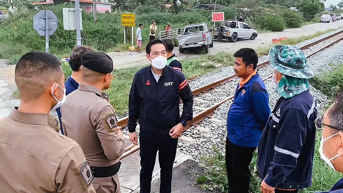 Several people were killed when a freight train struck a pickup truck, seen rear left, crossing the 