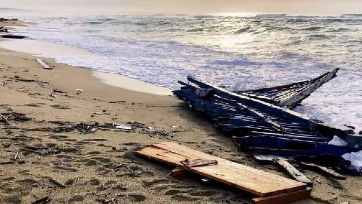 Part of the wreckage of a capsized boat that was washed ashore at a beach near Cutro, southern Italy