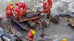 Rudraprayag: Rescuers pull out a body during a search operation after a landslide that occured on Aug 4, at Gauri Kund in Rudraprayag, Saturday, Aug. 12, 2023.