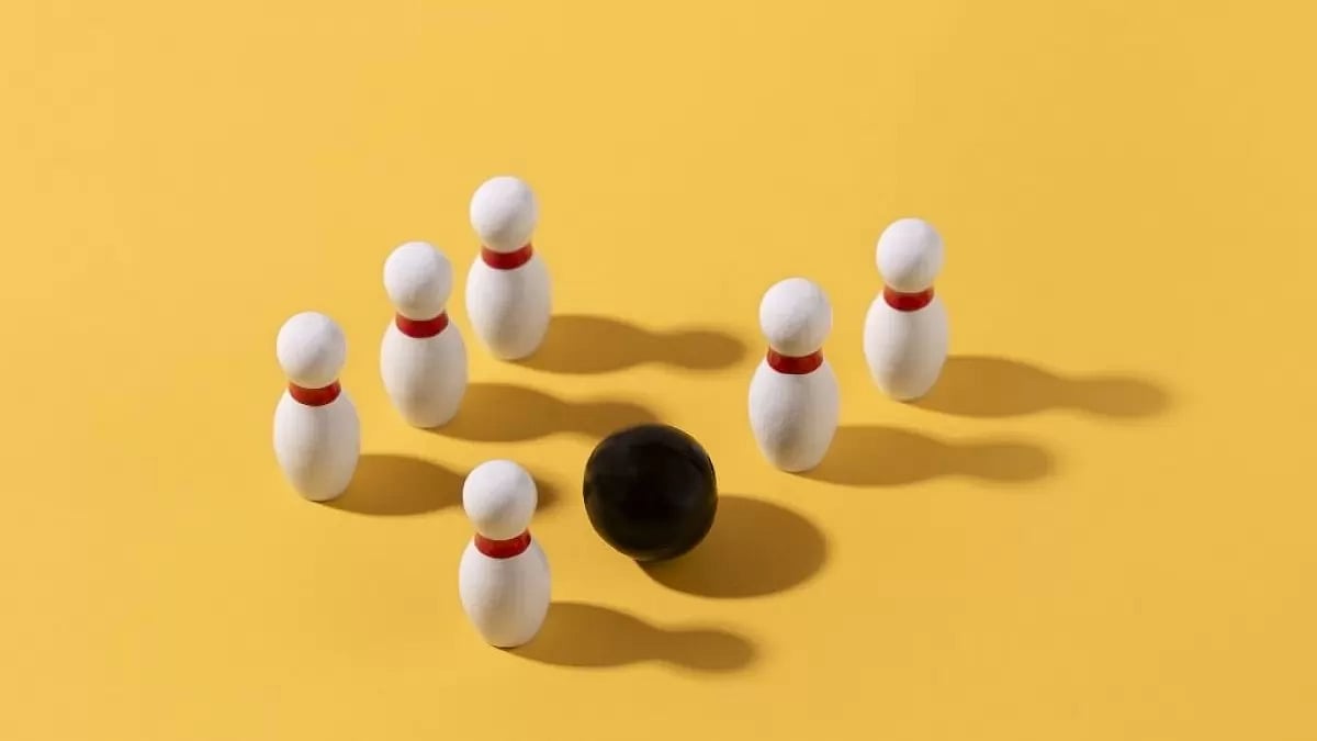  Representational image of bowling pins and bowling ball 