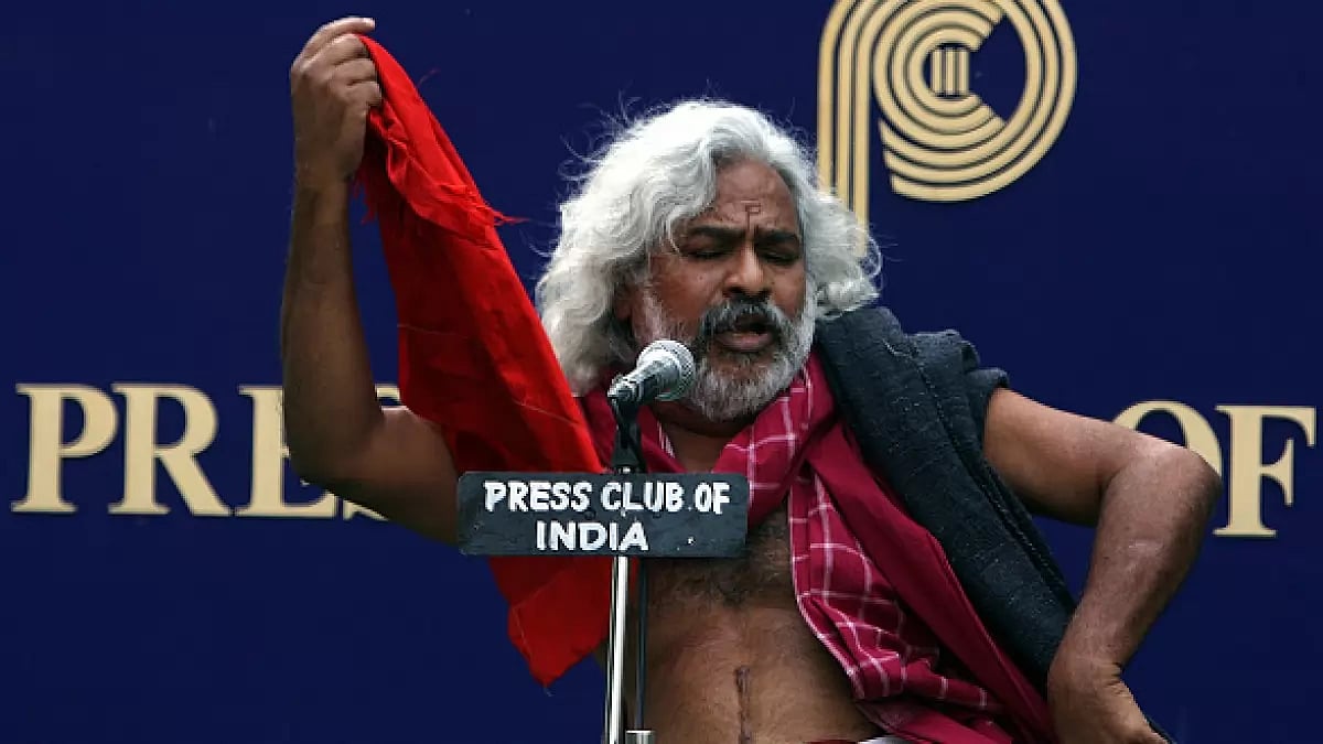 Gummadi Vittal Rao, a revolutionary Telugu balladeer and local Naxalite activist, performing during a press conference at Press Club of India, in New Delhi.
