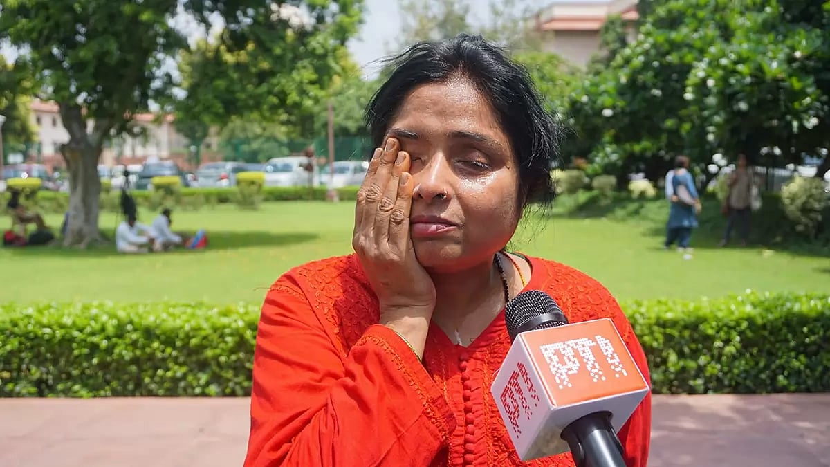 Nidhi Shukla, sister of deceased poet Madhumita Shukla, speaks with the media at the Supreme Court complex, in New Delhi. 