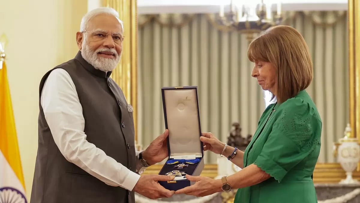 Greece President Katerina Sakellaropoulou felicitates PM Modi in Athens.