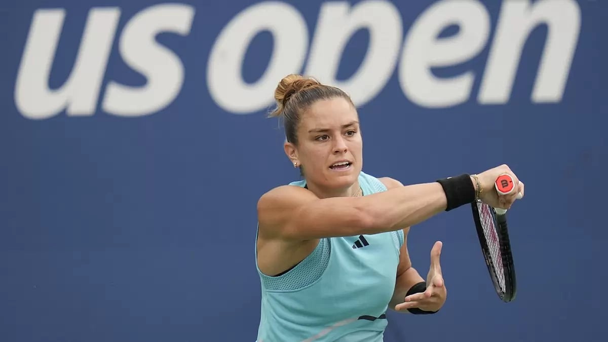 Maria Sakkari, of Greece, returns a shot to Rebeka Masarova, of Spain.