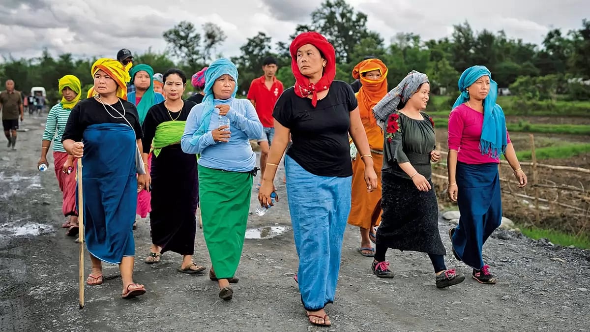 Peace March: Members of the Meitei community walk towards the site where a gunfight took place near Imphal recently