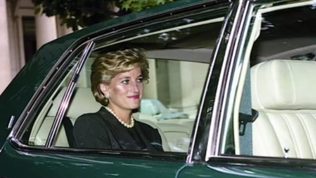Princess Diana sitting in a car