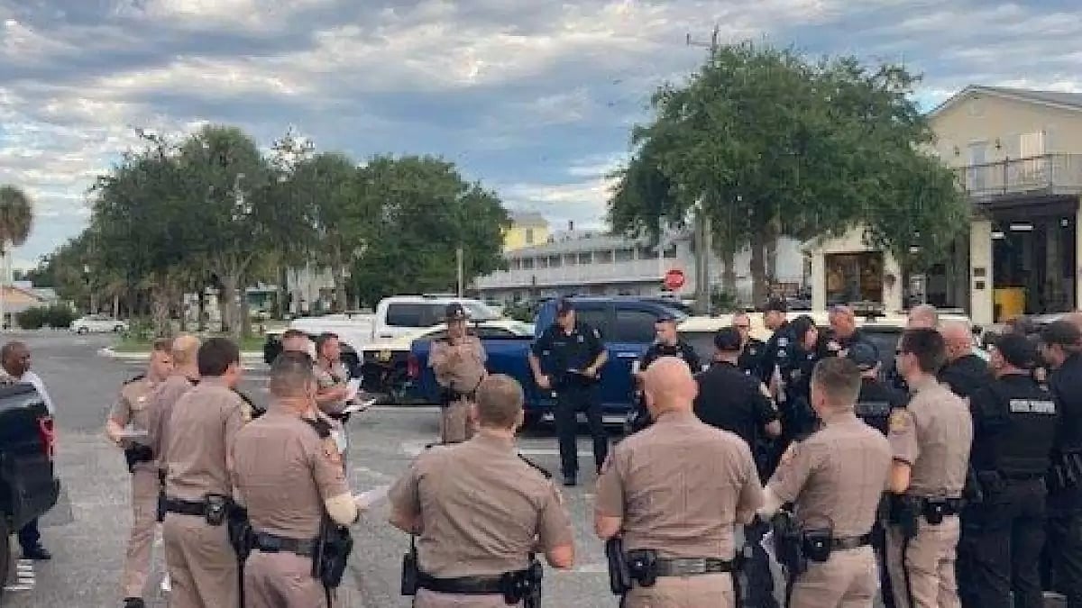 Police stand ready on a Florida highway to evacuate people