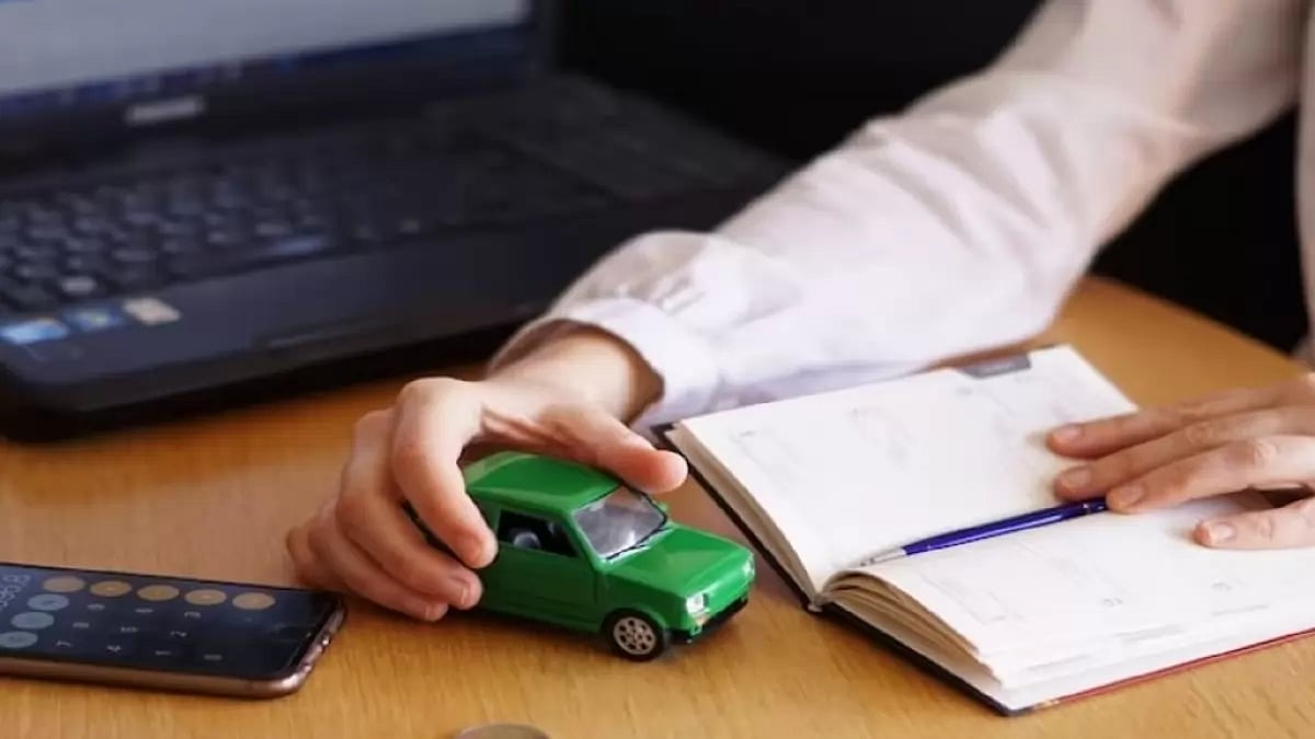 A person is calculating for buying a new car