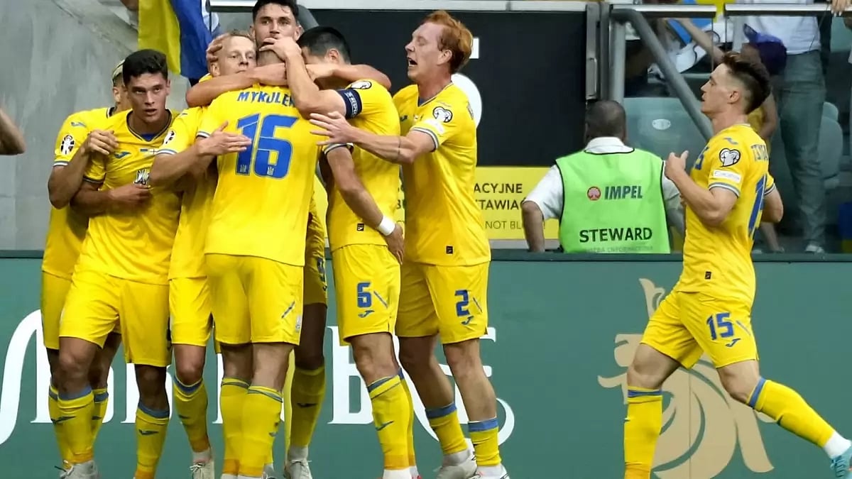 Ukrainian players celebrate after scoring against England in their Group C encounter.