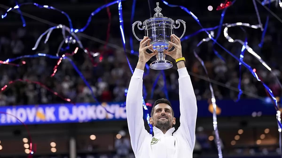 Novak Djokovic of Serbia holds up his US Open championship trophy