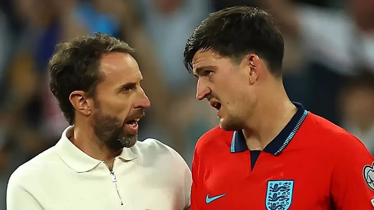 England boss Gareth Southgate and Harry Maguire (Right)