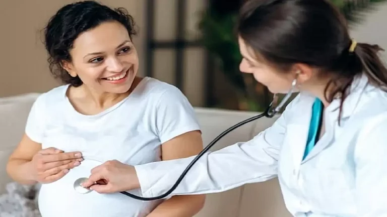 A doctor taking care of a pregnant woman - null