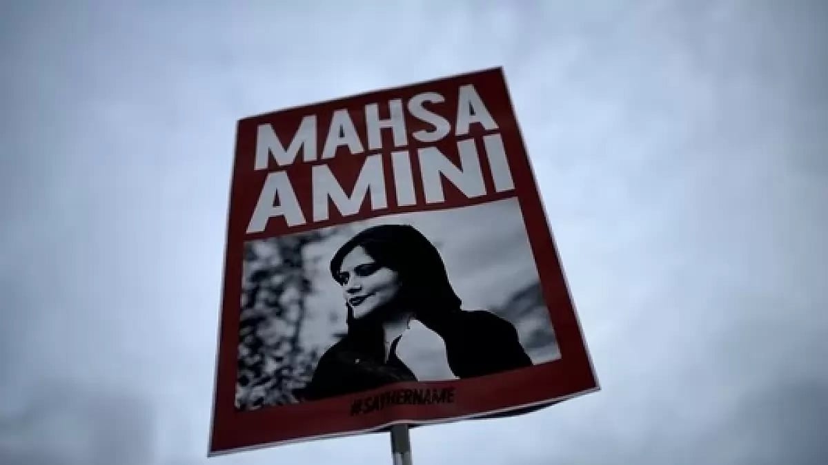 A placard shown at the protest against Mahsa Aminis death in Iran last year.