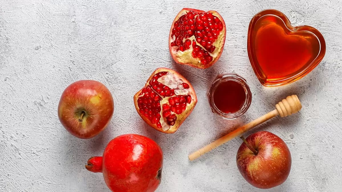 Apple and honey symbolize the sweetness of the year ahead during Rosh Hashanah celebrations. 