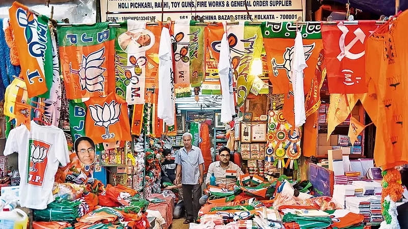 A shopkeeper in Kolkata displays campaign material