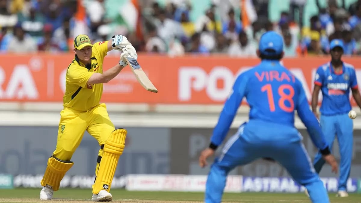Steve Smith bats as Virat Kohli looks on during the India vs Australia match in Rajkot on Wednesday.