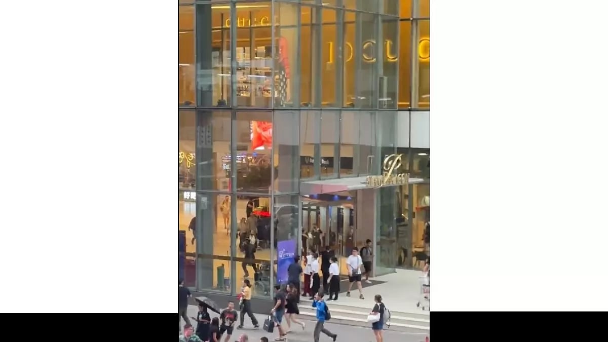 People seen running outside mall in Thailand's Bangkok.